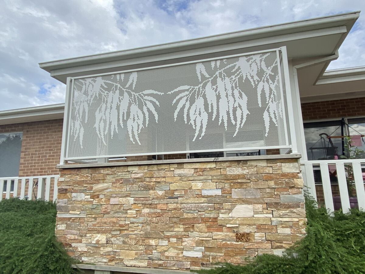 Gum design perforated screen in Textured Surfmist mounted on a stone wall, Victoria