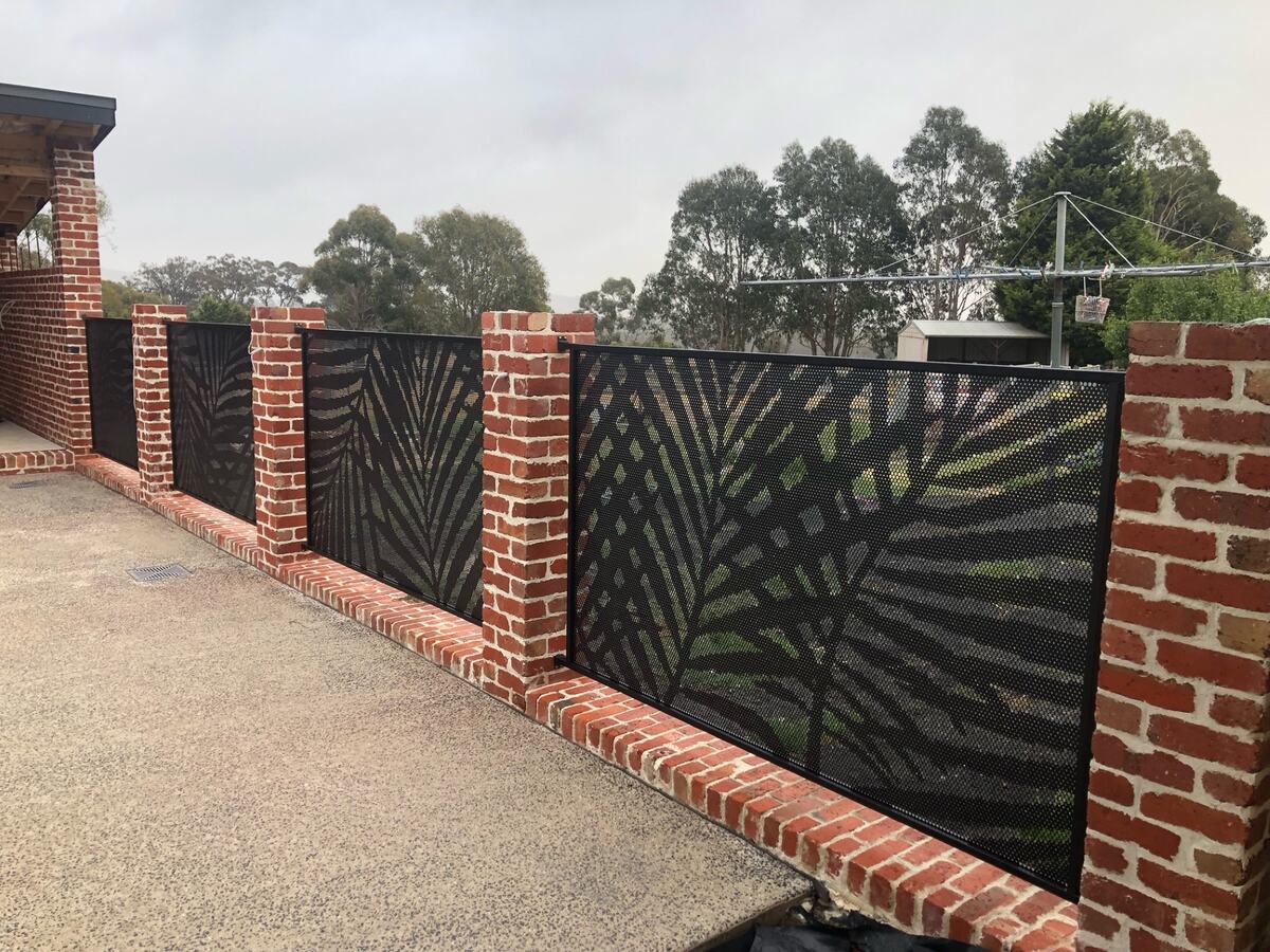 Palmy design pool fence panels between brick pillars, Melbourne
