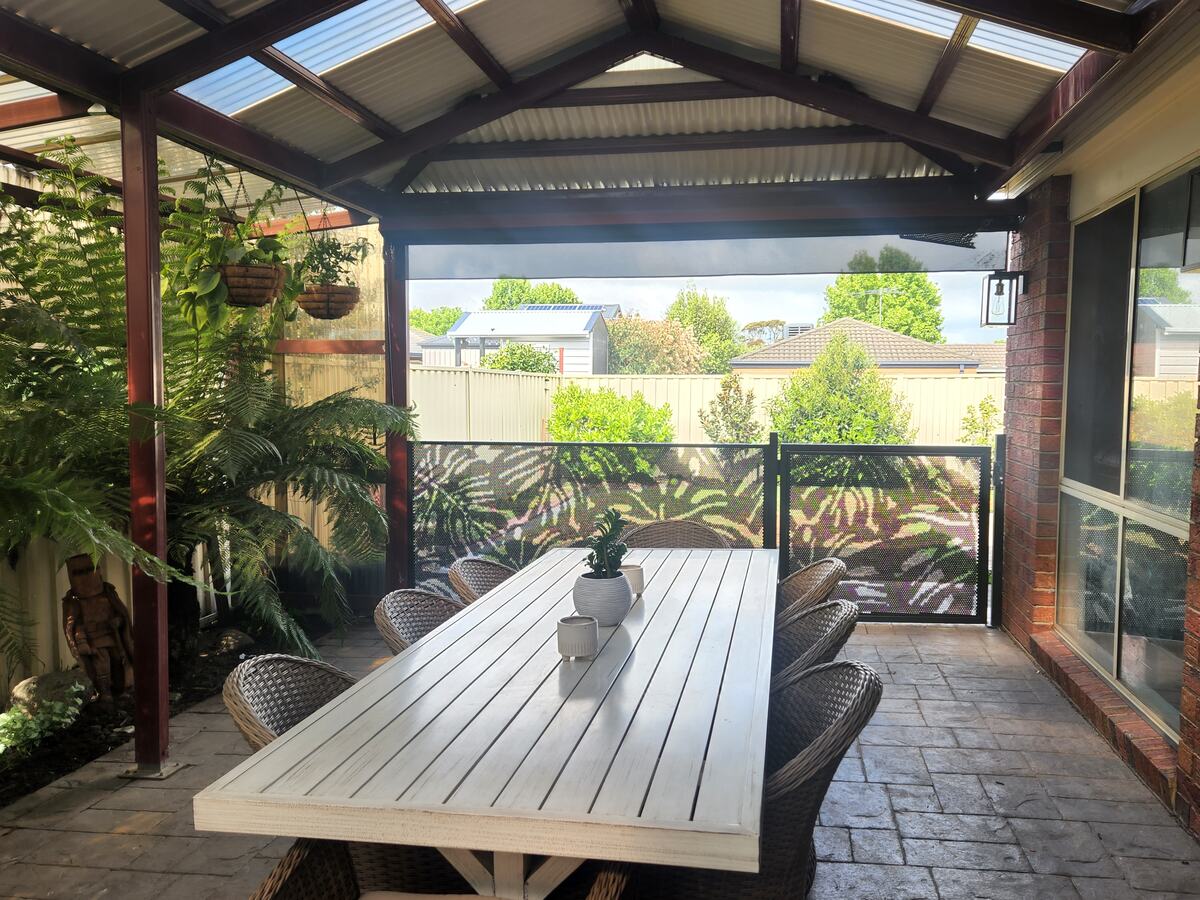 Monstera design perforated balustrade beside an alfresco dining area, Melbourne