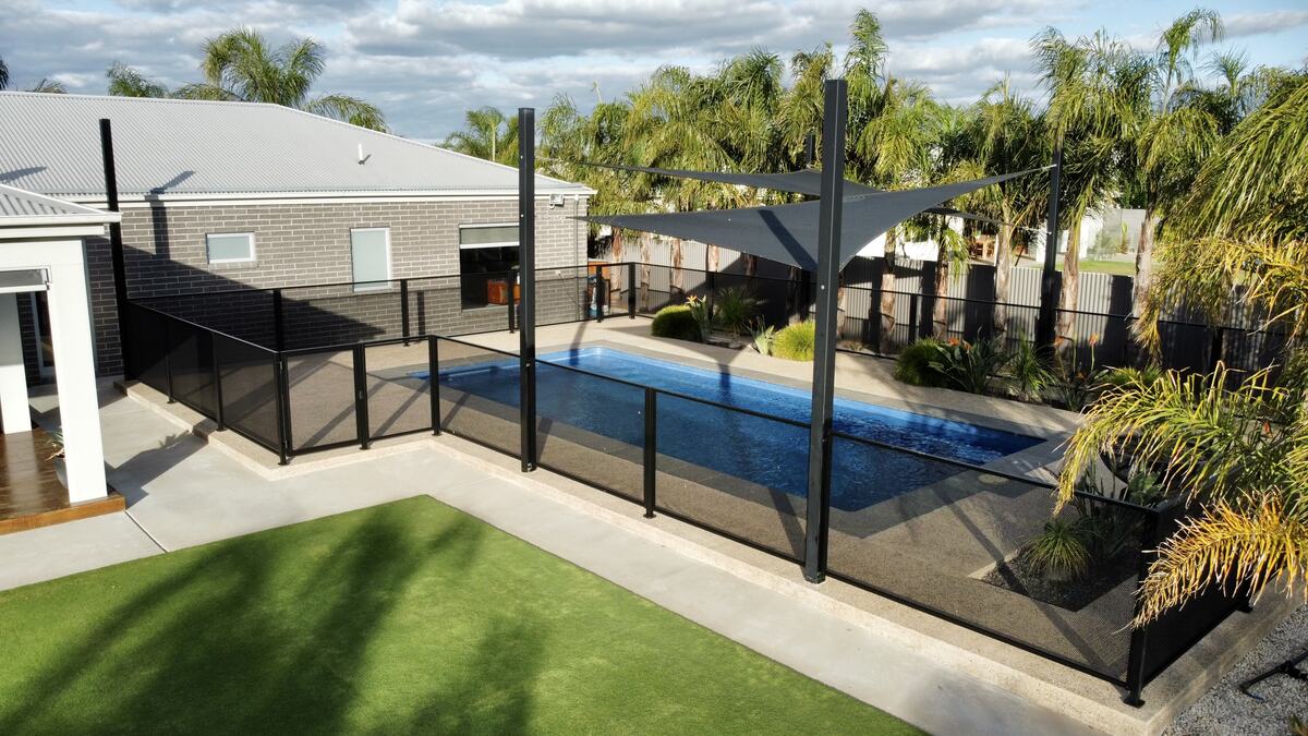 Pure Perf pool fencing in Textured Black beside a modern pool, Melbourne